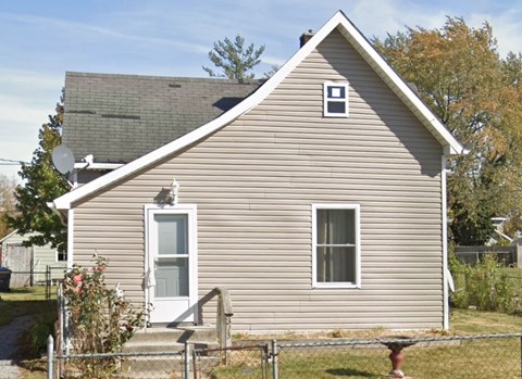 a house with a small window on the side of it