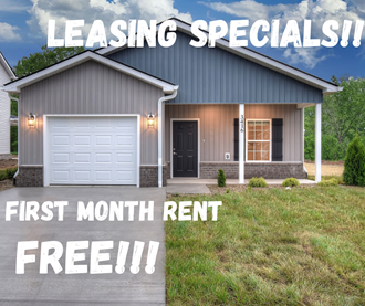 a house with a lawn and aing specials first month rent free