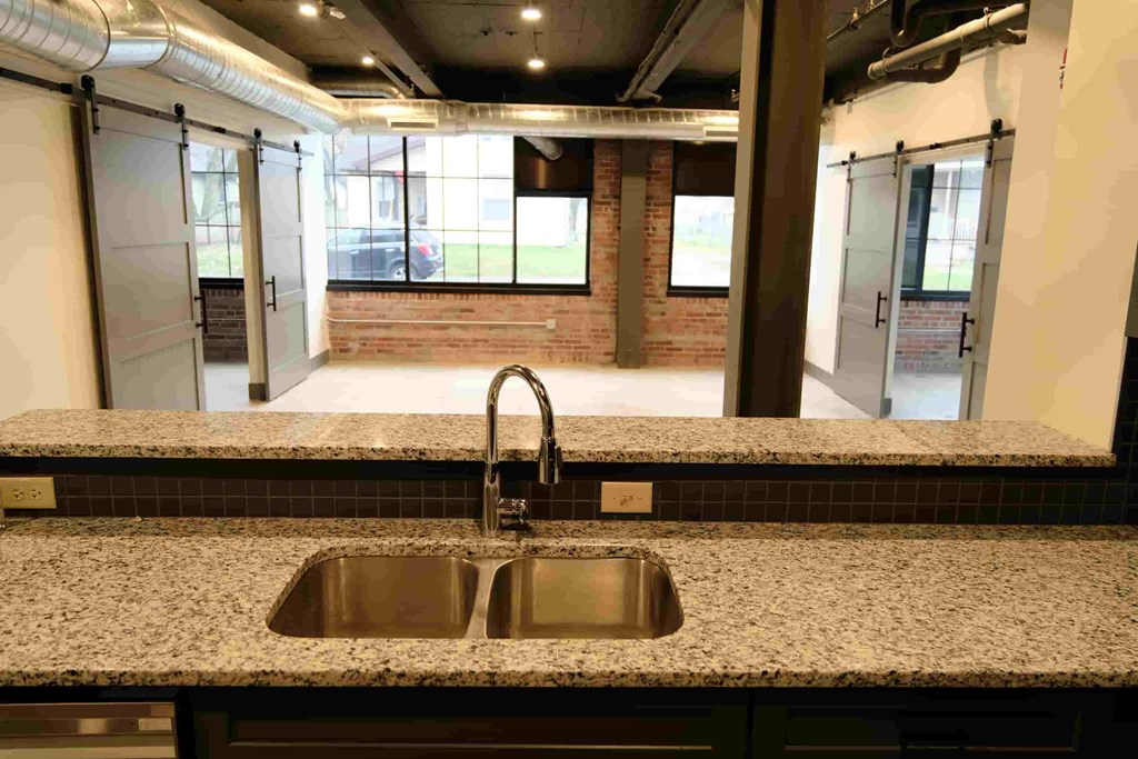 a kitchen with a sink and a window