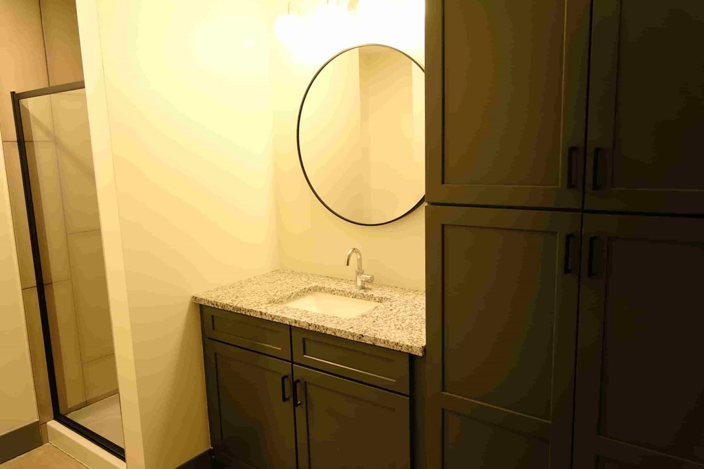 a small bathroom with a sink and a mirror