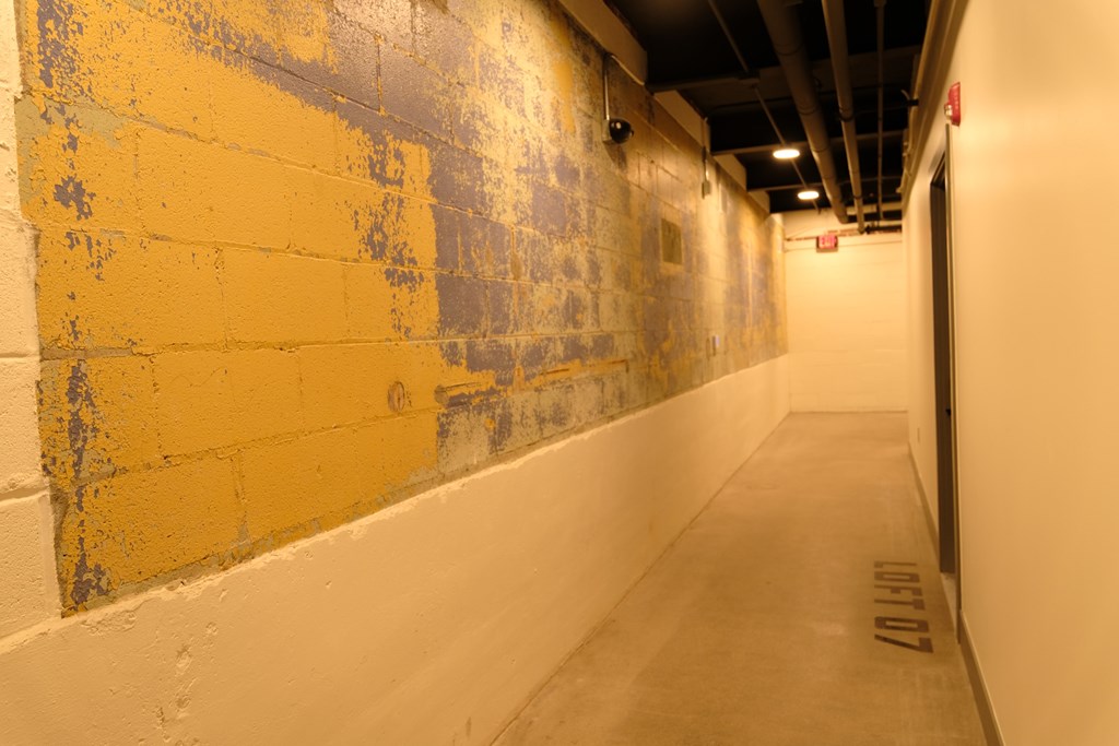 a wall of yellow and blue paint on a wall in a hallway