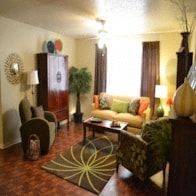 a living room with a couch and a table