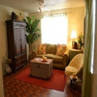 a living room with a couch and a table
