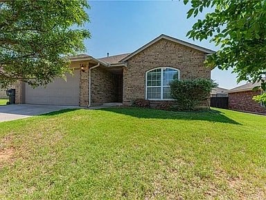 a house with a lawn in front of it