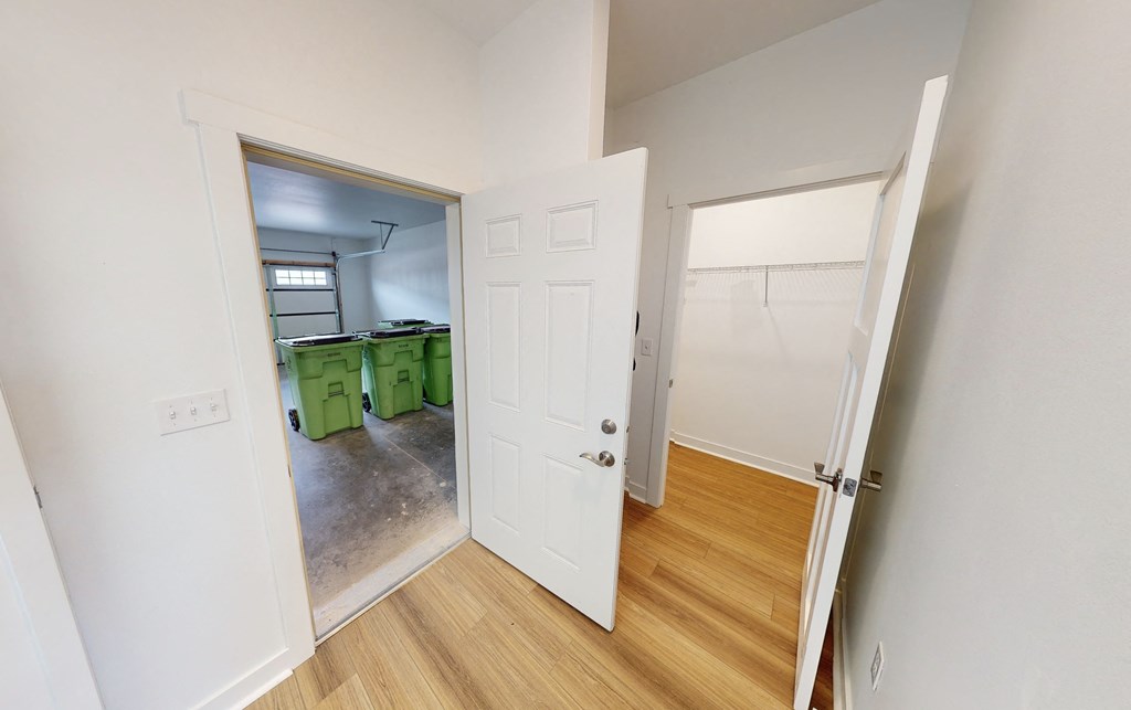 an open door leading into a kitchen