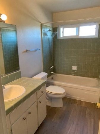 a bathroom with a sink toilet and a tub