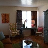 a living room filled with furniture and a table