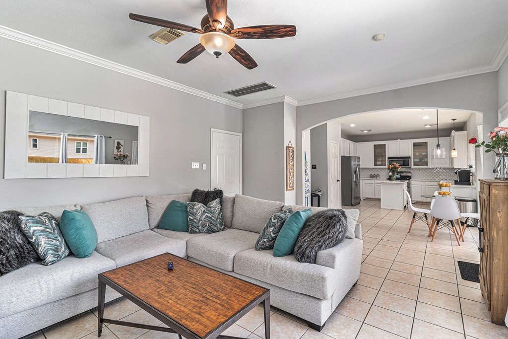 the living room is open to the kitchen and dining area
