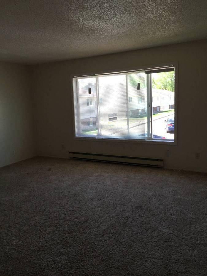 an empty room with a large window in it