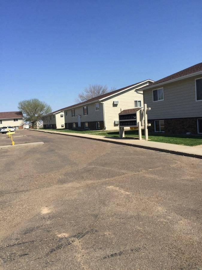 a row of houses on the side of a street