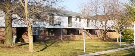 a house with a porch and a sidewalk