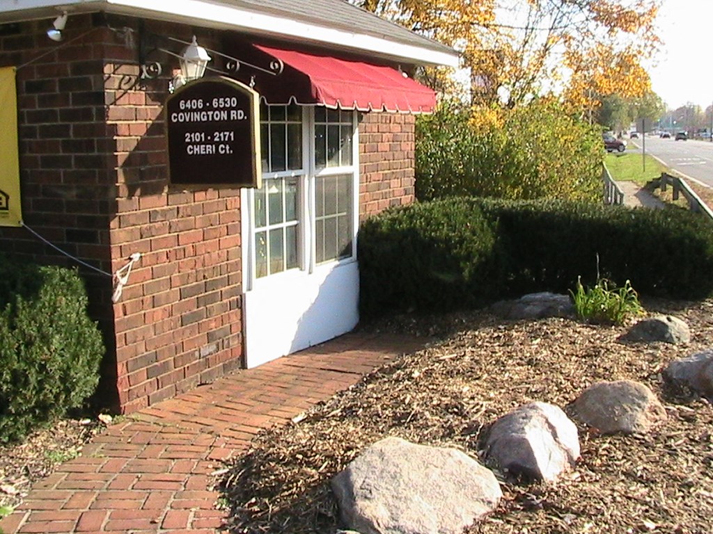 a brick building with a sign on the front of it