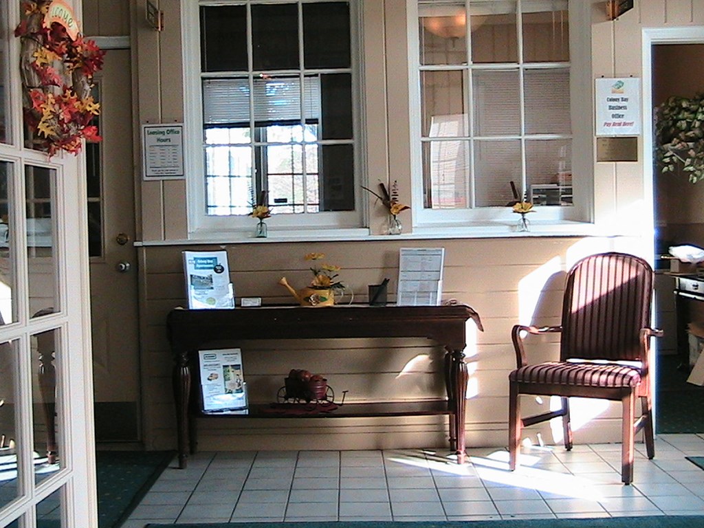 a living room with two chairs and a table
