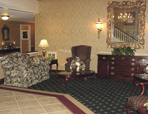 a living room with a couch and a chair