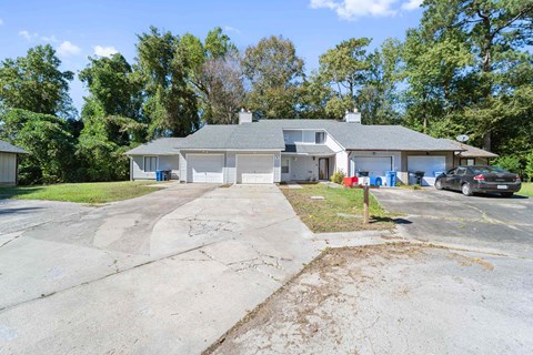 A house with a driveway in front of it.