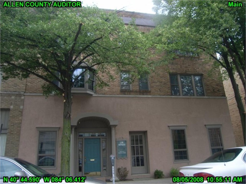 a building with a tree in front of it