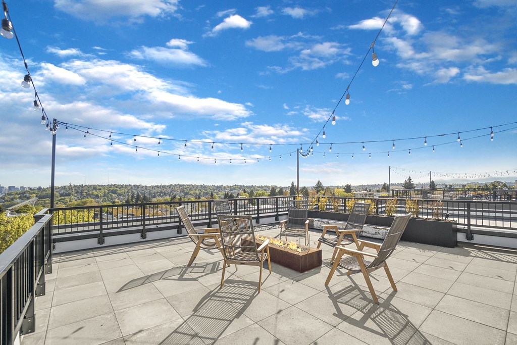 the terrace with patio furniture and views of the city