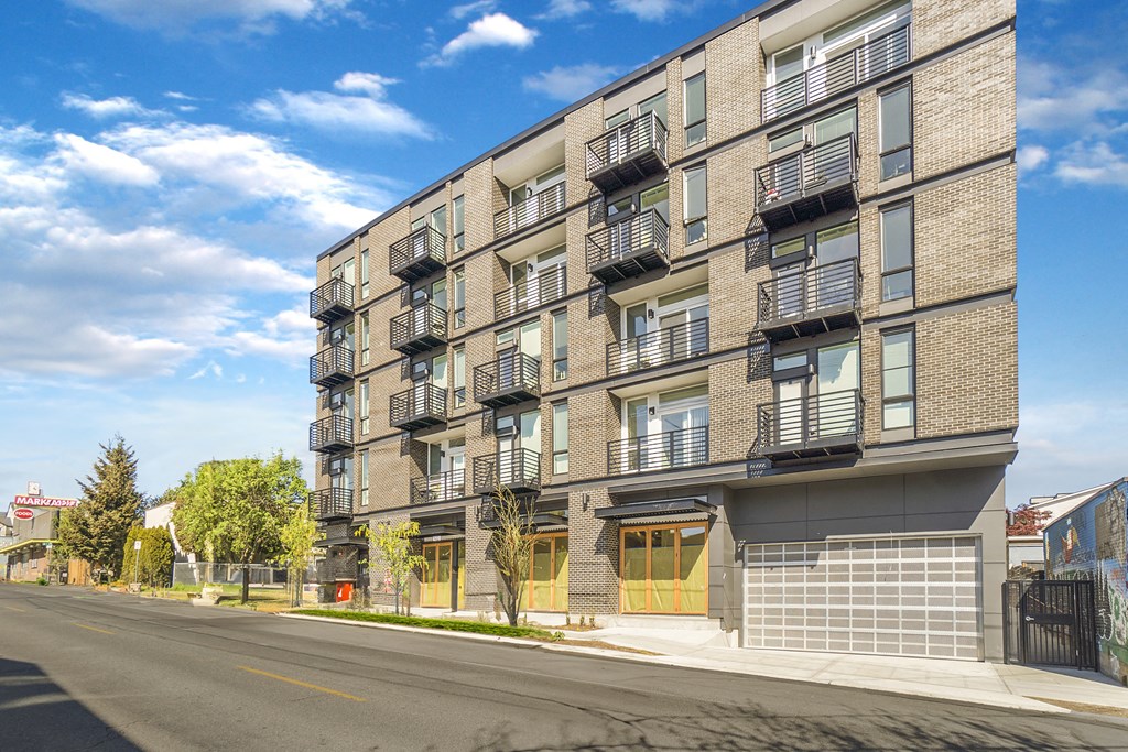 a large brick apartment building on a city street