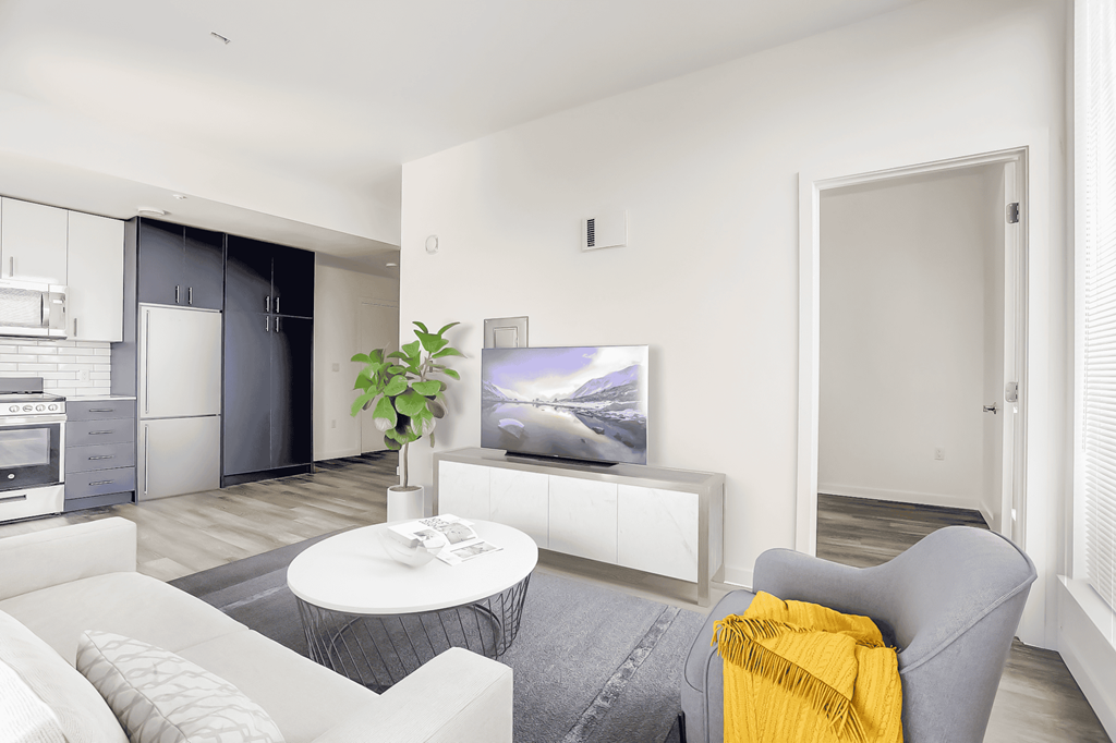 a living room with a couch and a table and a television