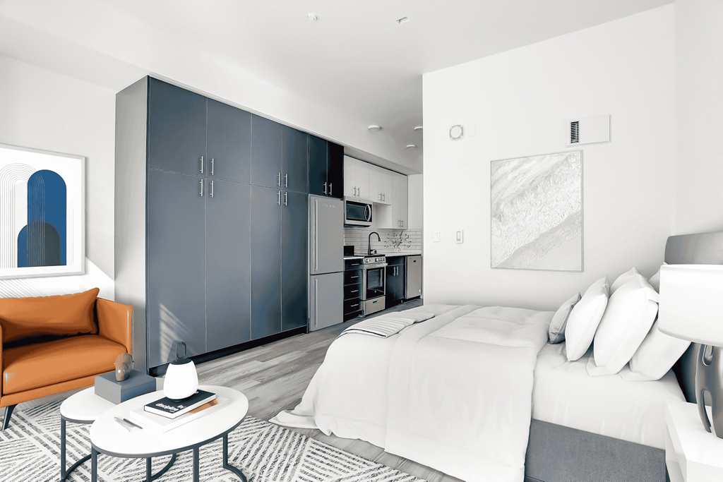 a bedroom with a large bed and a couch