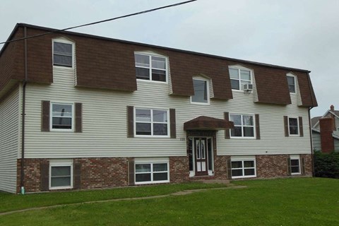 A two-story house with a brown and beige exterior.
