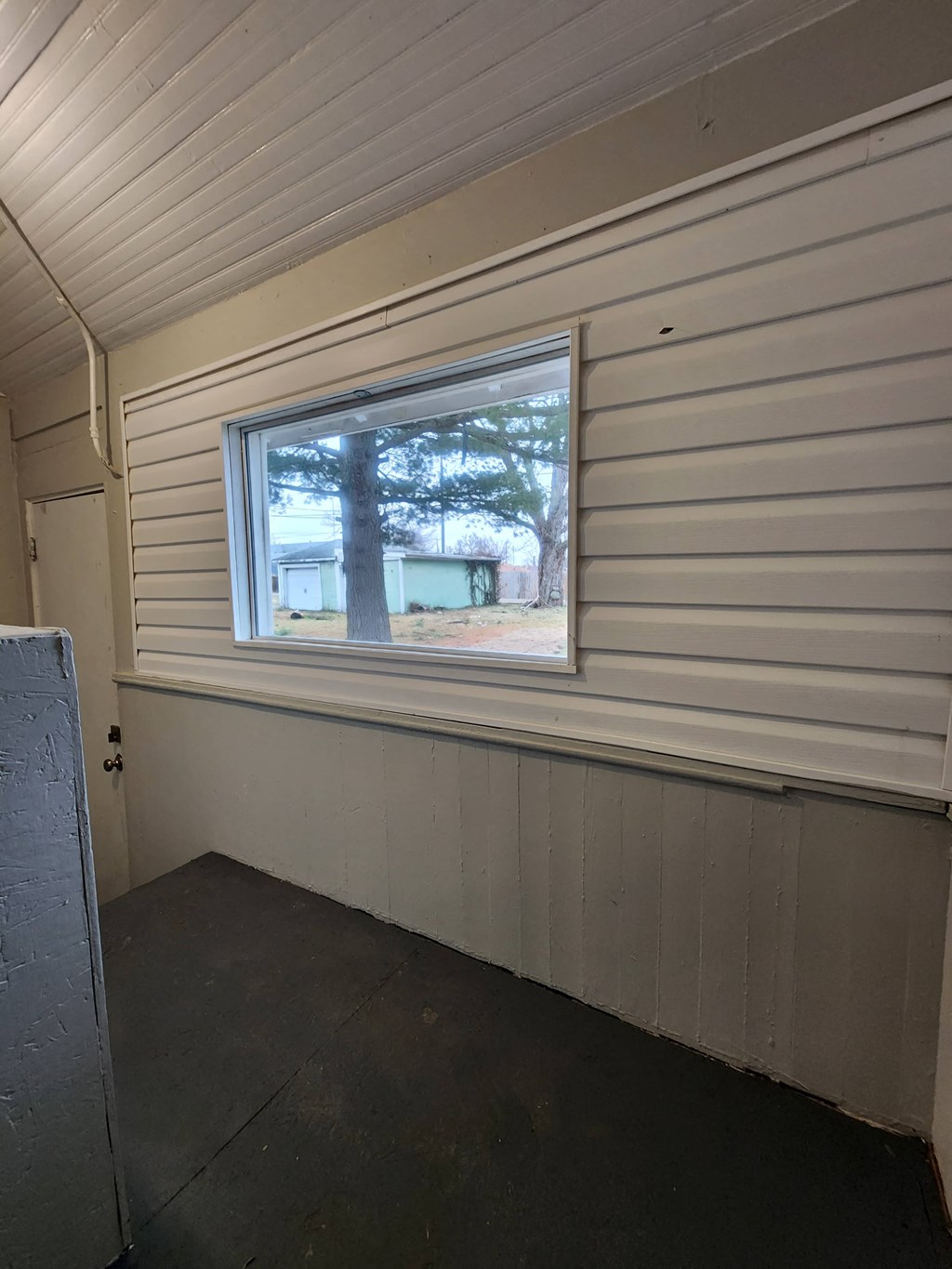 the inside of a shed with a window in it
