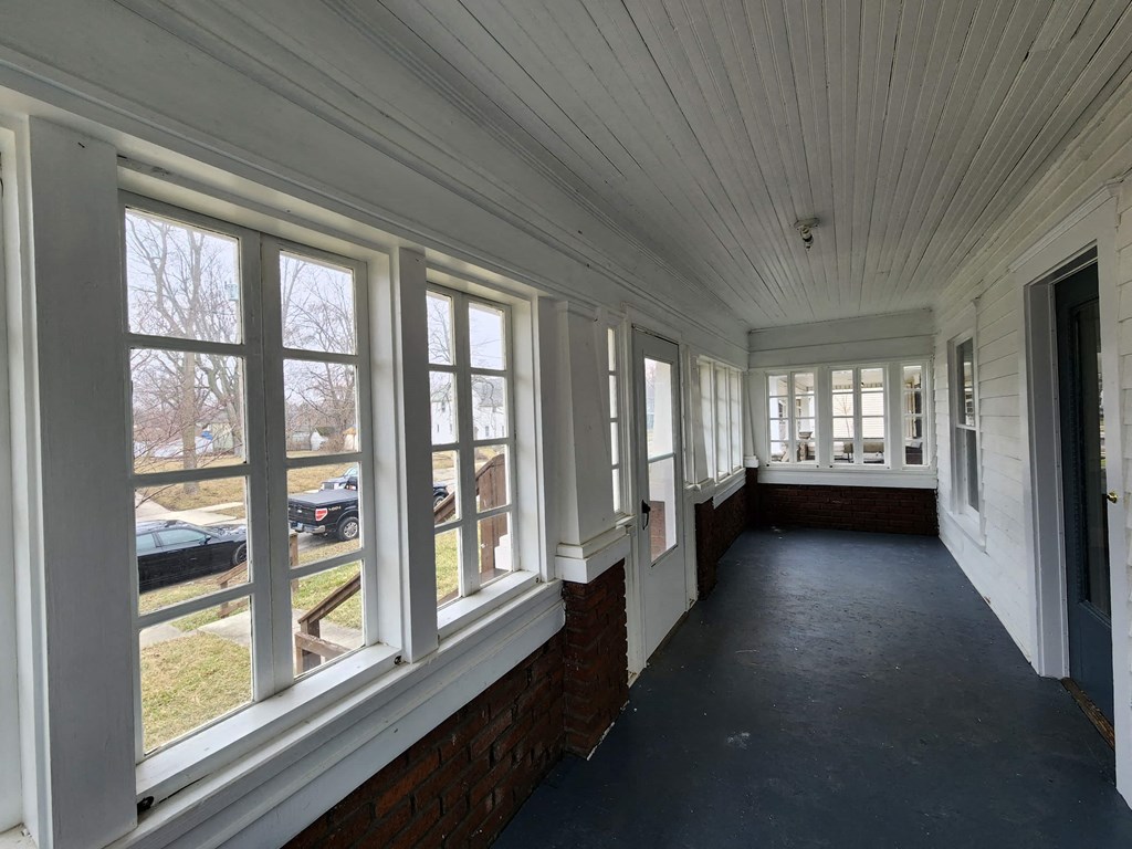 a view of a long hallway with large windows