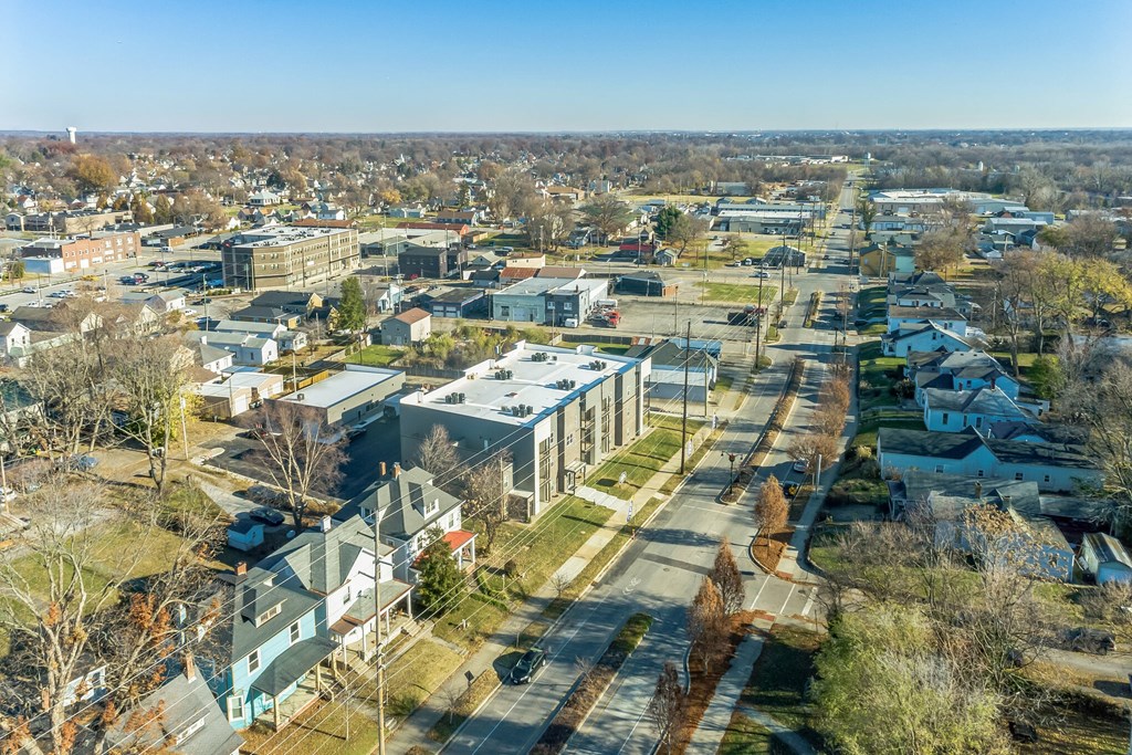 an aerial view of a city with buildings and trees