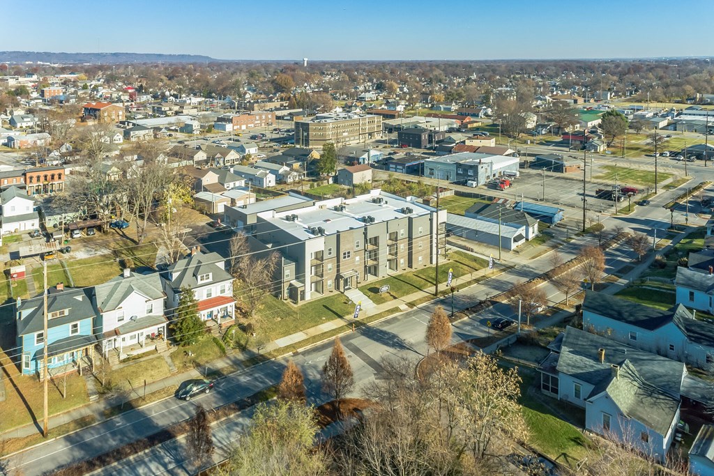 an aerial view of a city with houses and buildings