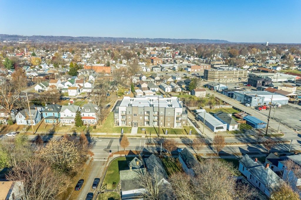 an aerial view of a neighborhood with houses and trees