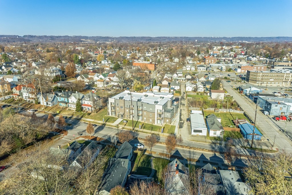an aerial view of a city with houses and trees