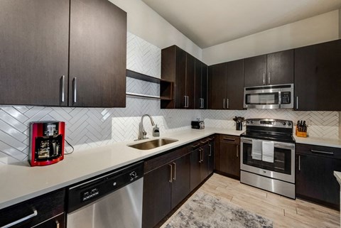 a kitchen with a sink and a stove
