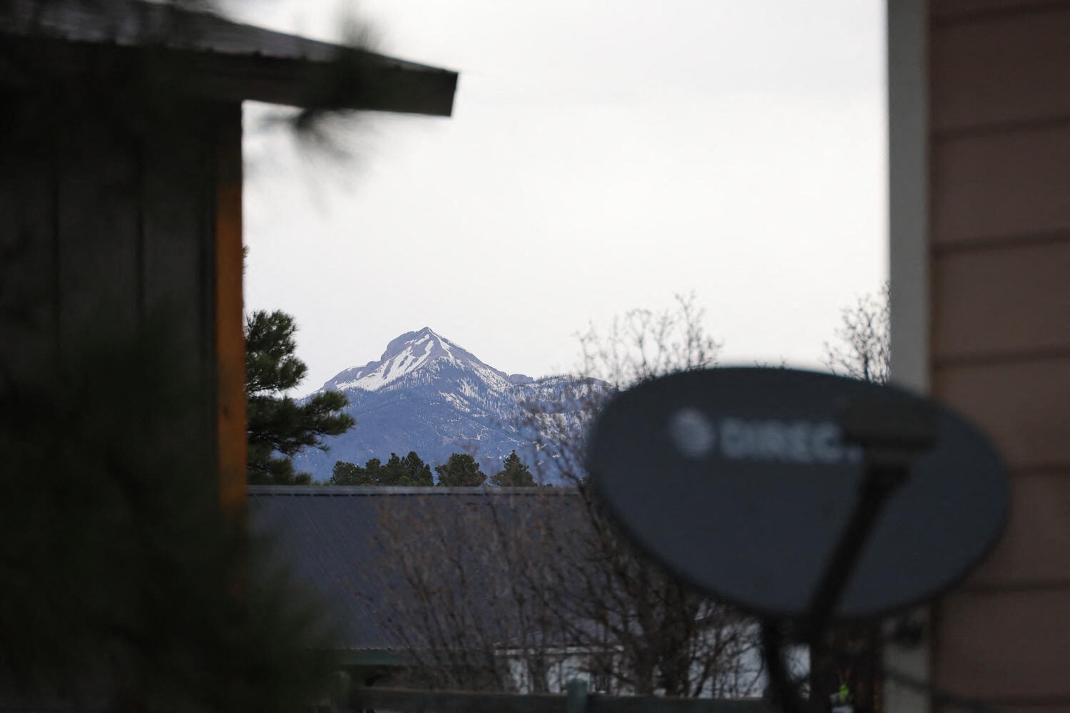 a view of a mountain from a window of a building