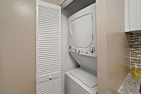 the washer and dryer in the laundry room of a home