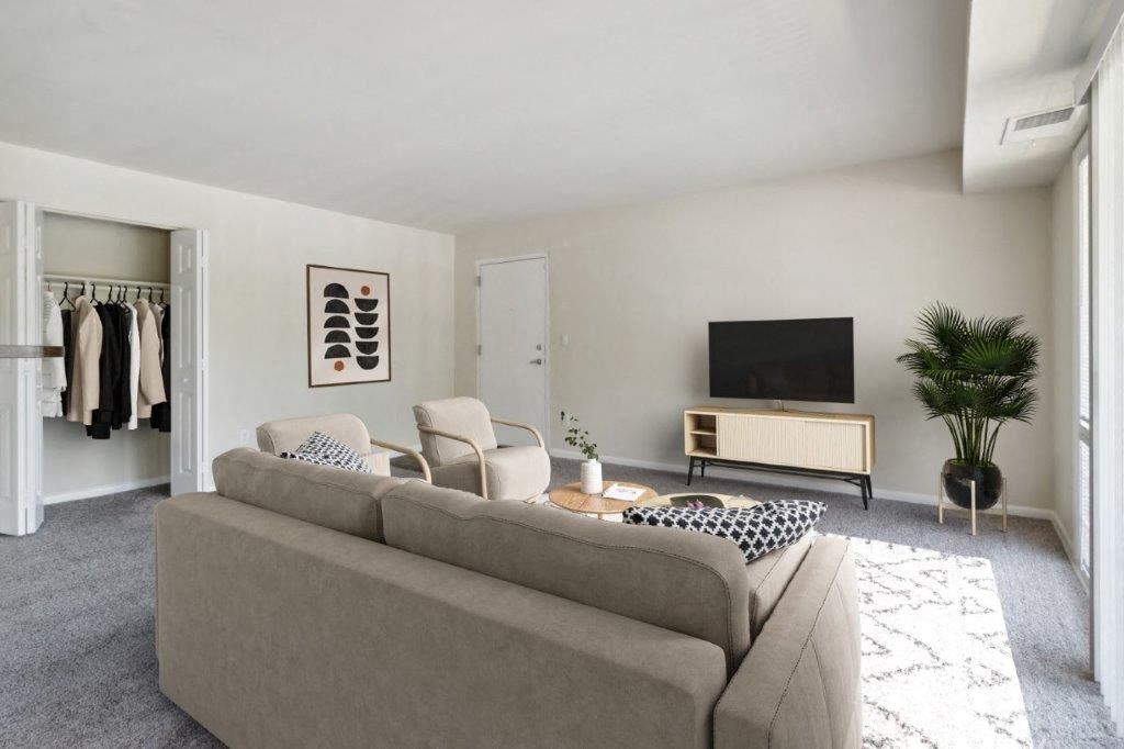 a living room with a couch and a tv