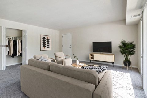 a living room with a couch and a tv