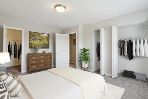 a bedroom with a bed and a dresser and a closet