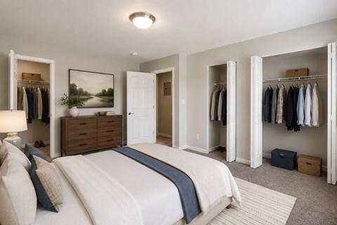 A bedroom with a large bed and a wardrobe.