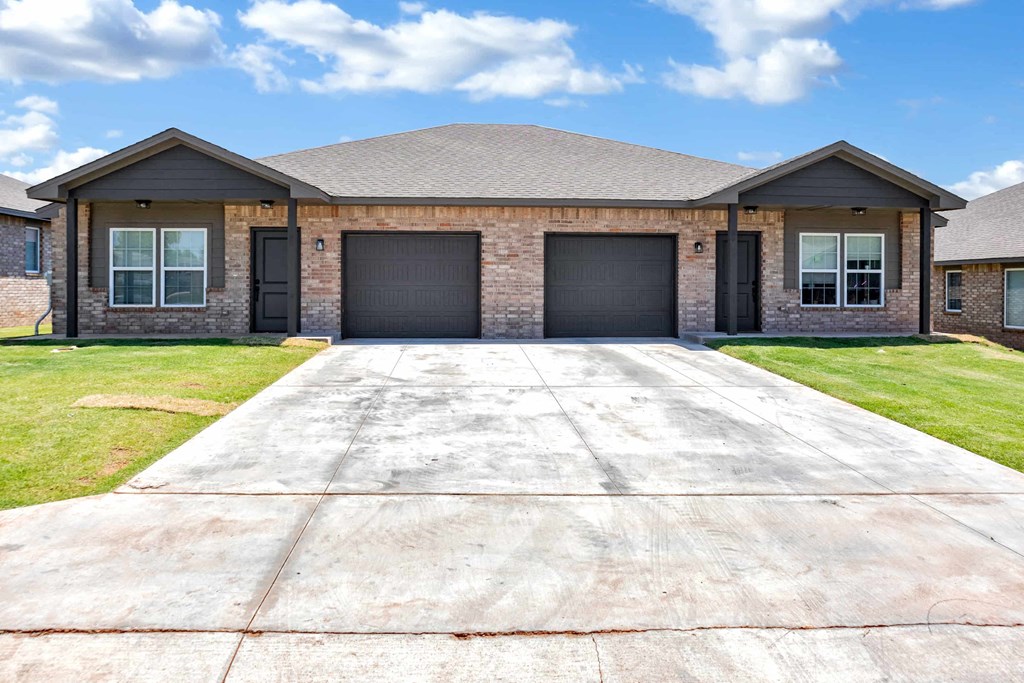 a house with a driveway and a garage door