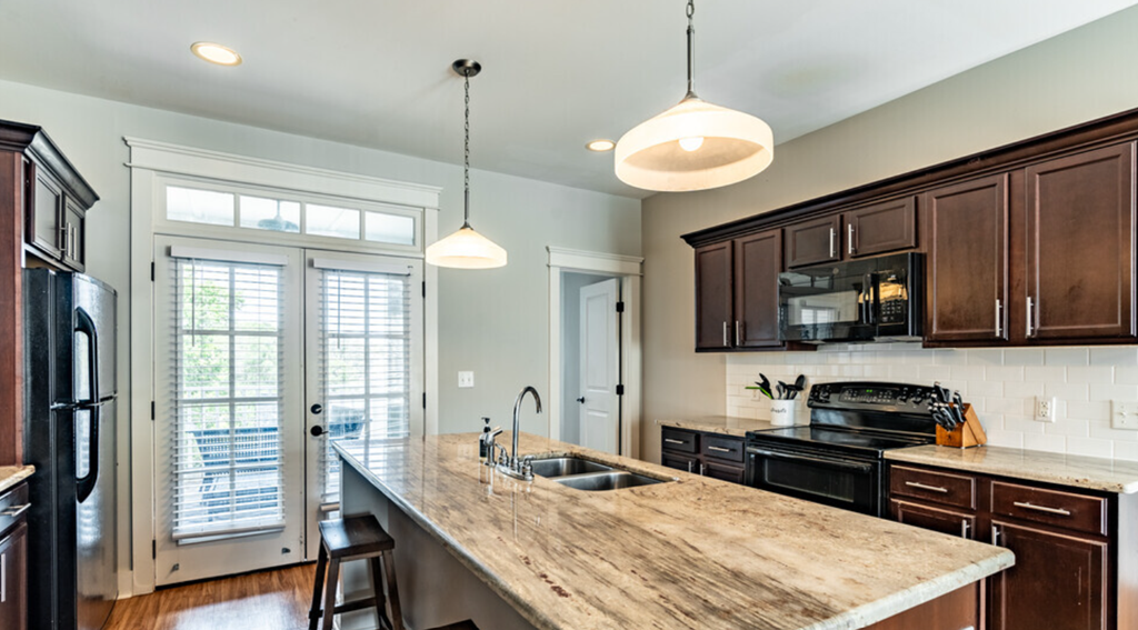 a kitchen with a large counter top and a sink