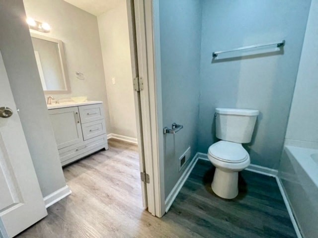 a bathroom with a toilet and a sink