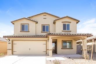 a beige house with a garage door in front of it