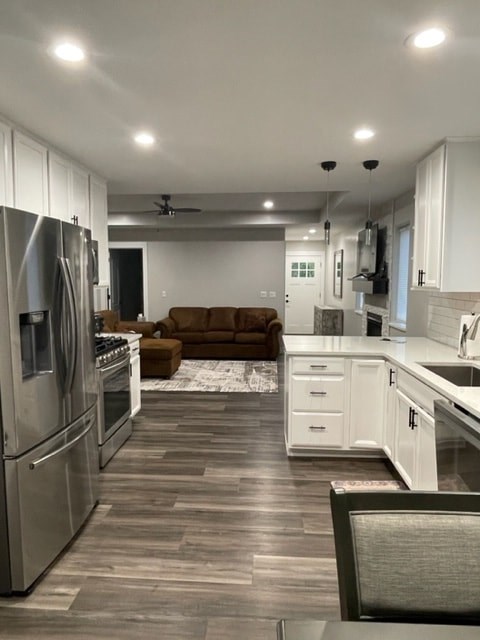 a kitchen and a living room in a house