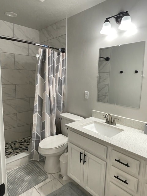 a bathroom with a sink toilet and a shower