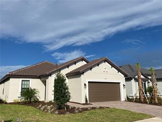 a house with a garage door in front of it