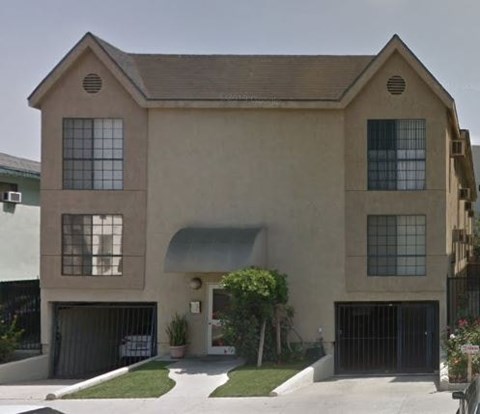 a large house with a driveway and a garage