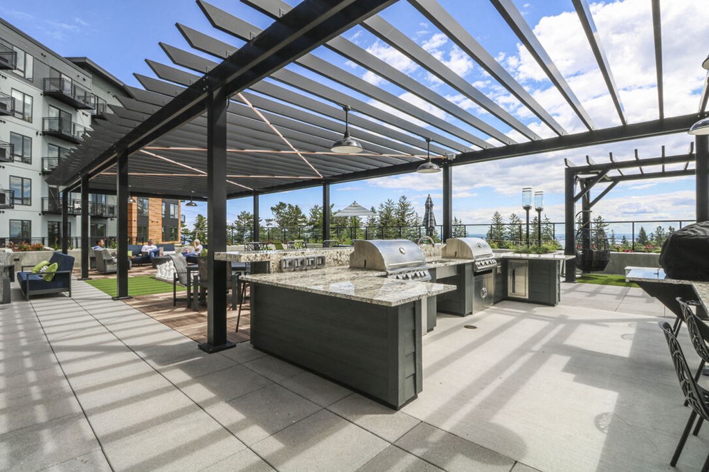 Gathering Area With Grills And Corn Hole at Vue at Bluestone, Duluth, MN, 55803