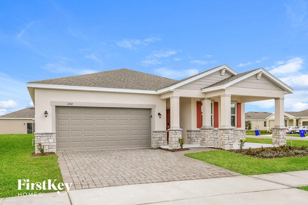 a house with a driveway and a garage door
