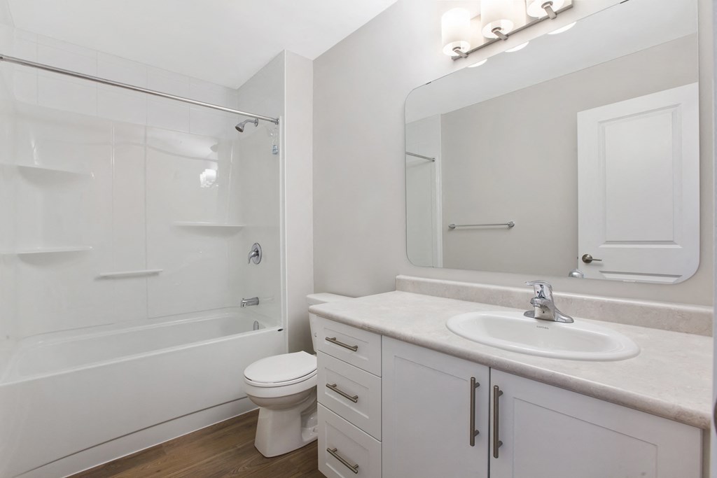 a bathroom with a sink toilet and a shower