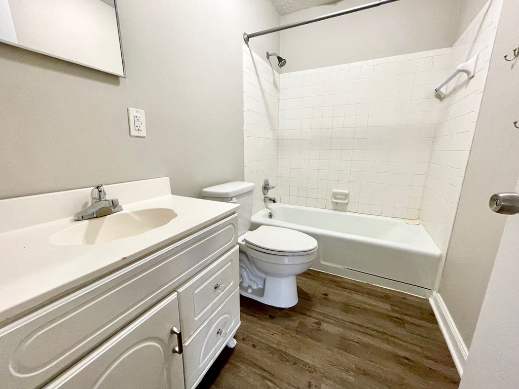 a bathroom with a sink toilet and a bath tub